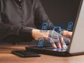 Businessman working at a laptop and digital documents with checkbox lists on virtual screen. Online documentation database and