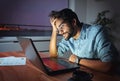 Businessman working on a laptop, overworking, under pressure