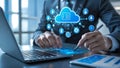 Businessman working on laptop and tablet with cloud computing concept icons Royalty Free Stock Photo