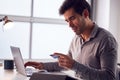 Businessman Working Late On Laptop At Desk In Office Making Online Payment With Credit Card Royalty Free Stock Photo