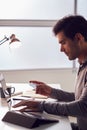 Businessman Working Late On Laptop At Desk In Office Making Online Payment With Credit Card Royalty Free Stock Photo