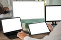 A businessman is working on a mock-up. Using a laptop with a blank copy space screen for your advertising text message computer