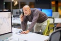 Businessman working a modern office and using mobile phone and computers Royalty Free Stock Photo