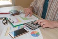 Businessman working on office desk with Calculator, a computer, a pen and document. Man, counting money Royalty Free Stock Photo