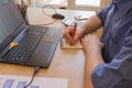 Businessman working on office desk with Calculator, a computer, a pen and document. Man, counting money Royalty Free Stock Photo