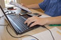 Businessman working on office desk with Calculator, a computer, a pen and document. Man, counting money Royalty Free Stock Photo