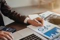 Businessman working at office with laptop and documents on his desk, financial adviser analyzing data Royalty Free Stock Photo