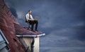 Businessman working on the roof