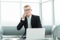 Businessman working sitting in the lobby of the business center. Royalty Free Stock Photo