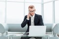 Businessman working sitting in the lobby of the business center. Royalty Free Stock Photo