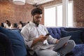 Businessman Working On Sofa In Modern Creative Office Royalty Free Stock Photo