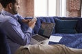 Businessman Working On Sofa In Modern Creative Office Royalty Free Stock Photo