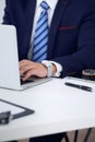 Businessman working by typing on laptop computer. Man`s hands on notebook or business person at workplace. Employment o Royalty Free Stock Photo