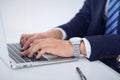 Businessman working by typing on laptop computer. Man`s hands on notebook or business person at workplace. Employment o Royalty Free Stock Photo