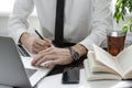 Businessman working in workplace.Stylish man in shirt and tie.