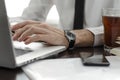 Businessman working in workplace.Stylish man in shirt and tie.