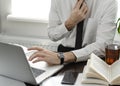 Businessman working in workplace.Stylish man in shirt and tie.