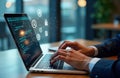 Businessman works on laptop managing digital documents on virtual screen. ERP system, file management software used. Virtual