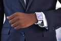 Businessman, wrist and smart watch on arm for online schedule, digital agenda and high tech for job. Black man, hand and Royalty Free Stock Photo