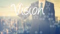 businessman writes on board text: Vision - with sunset over the