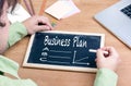 Businessman Writing Business Plan Growth Concept. Chalkboard on Royalty Free Stock Photo