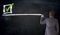Businessman writing checkbox on blackboard concept Royalty Free Stock Photo