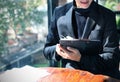 Businessman Writing Clipboard Business Progress in the morning.