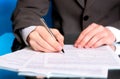 Businessman writing on a form Royalty Free Stock Photo