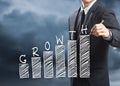 Businessman writing growth chart concept Royalty Free Stock Photo