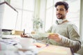 Businessman writing from note in office Royalty Free Stock Photo