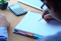 Businessman writing on notepad at office desk Royalty Free Stock Photo