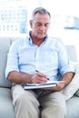 Businessman writing on notepad at office Royalty Free Stock Photo