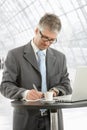 Businessman writing notes Royalty Free Stock Photo