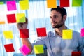 Businessman writing on post it Royalty Free Stock Photo