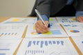 Businessman writing on sticky note on business document. paper r Royalty Free Stock Photo