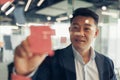 Businessman writing on sticky notes on glass wall while working in modern office Royalty Free Stock Photo