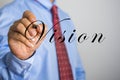 Businessman writing VISION on virtual screen Royalty Free Stock Photo
