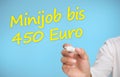 Businessman writing in yellow minijob bis 450 euro Royalty Free Stock Photo