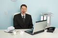 Businessman yawning from boredom and idleness