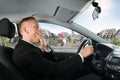 Businessman yawning while driving car Royalty Free Stock Photo