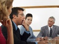 Businessman Yawning During Meeting At Conference Room Royalty Free Stock Photo