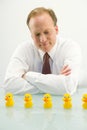 Businessman and yellow ducks