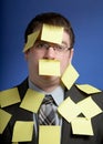 Businessman with yellow notes