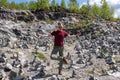 a businessman in a yoga pose in the middle of marble stones