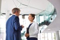 Businessman and young businesswoman discussing at new office Royalty Free Stock Photo