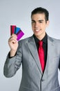 Businessman young with three credit cards Royalty Free Stock Photo