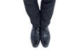 Businessmans feet in black brogues Royalty Free Stock Photo