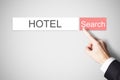 Businessmans finger pressing search button hotel webbrowser Royalty Free Stock Photo