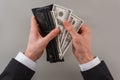 Businessmans hands holding open wallet with money. Royalty Free Stock Photo