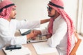 Businessmen arabian are signature contract agreement and handshake greeting together Royalty Free Stock Photo